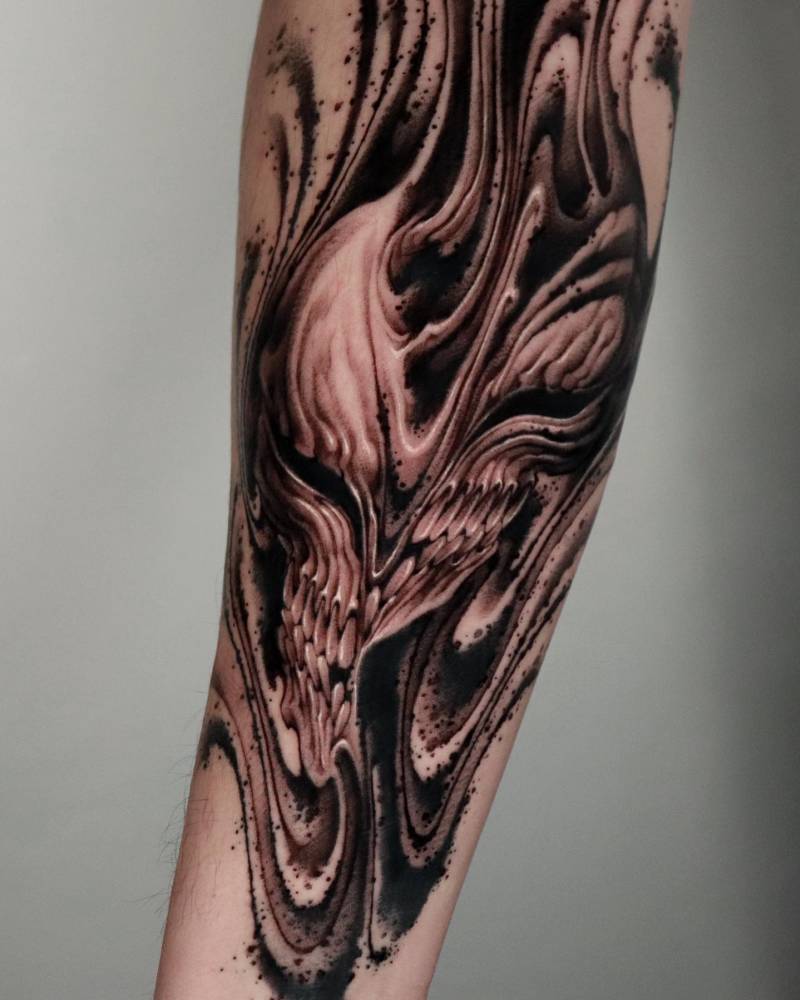 Abstract Ichigo tattoo in blackwork style done on the inner forearm.