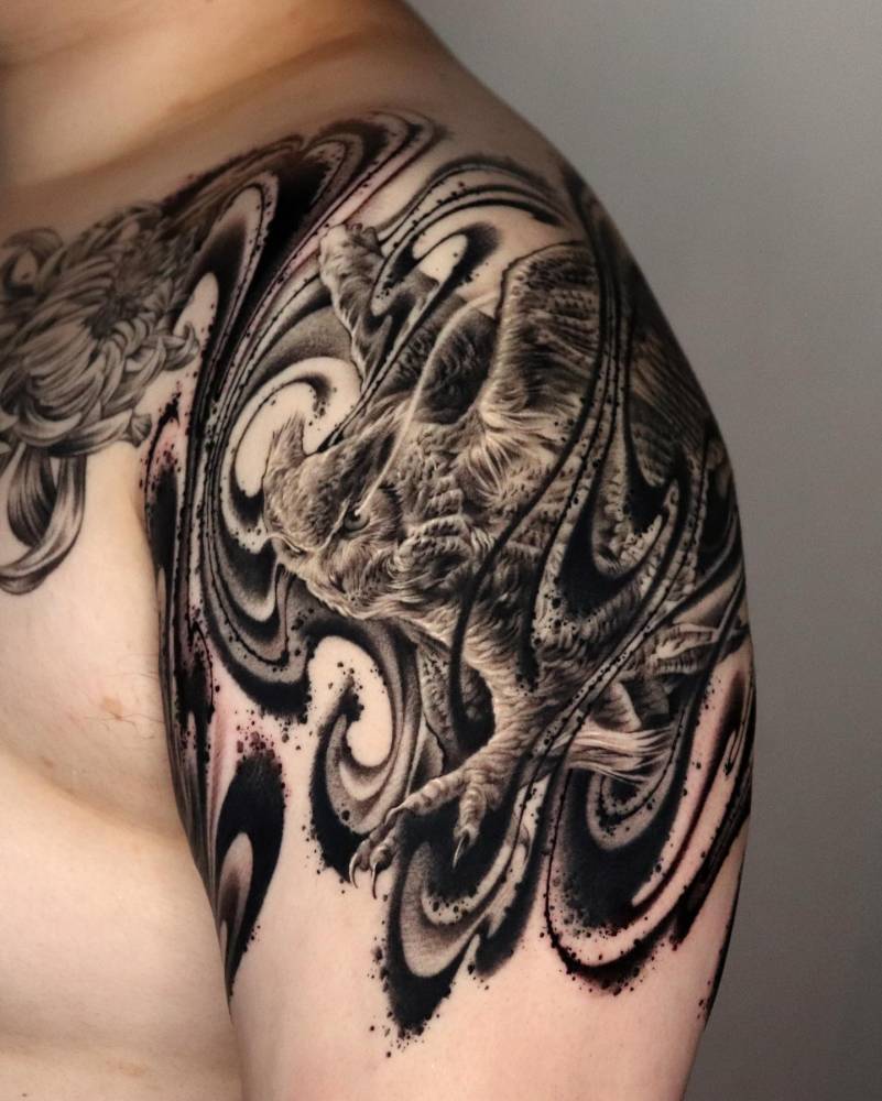 Healed owl tattoo done in abstract style located on the shoulder.