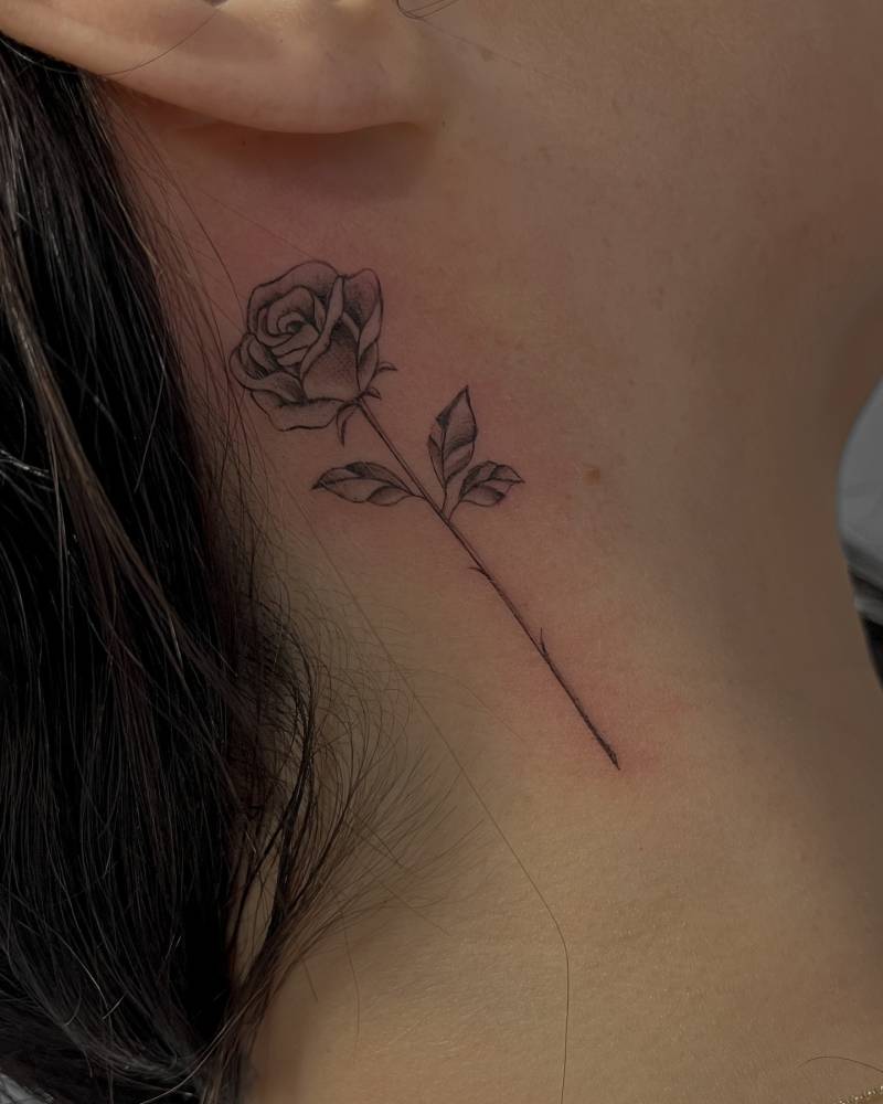 Illustrative style rose tattoo done on the neck.