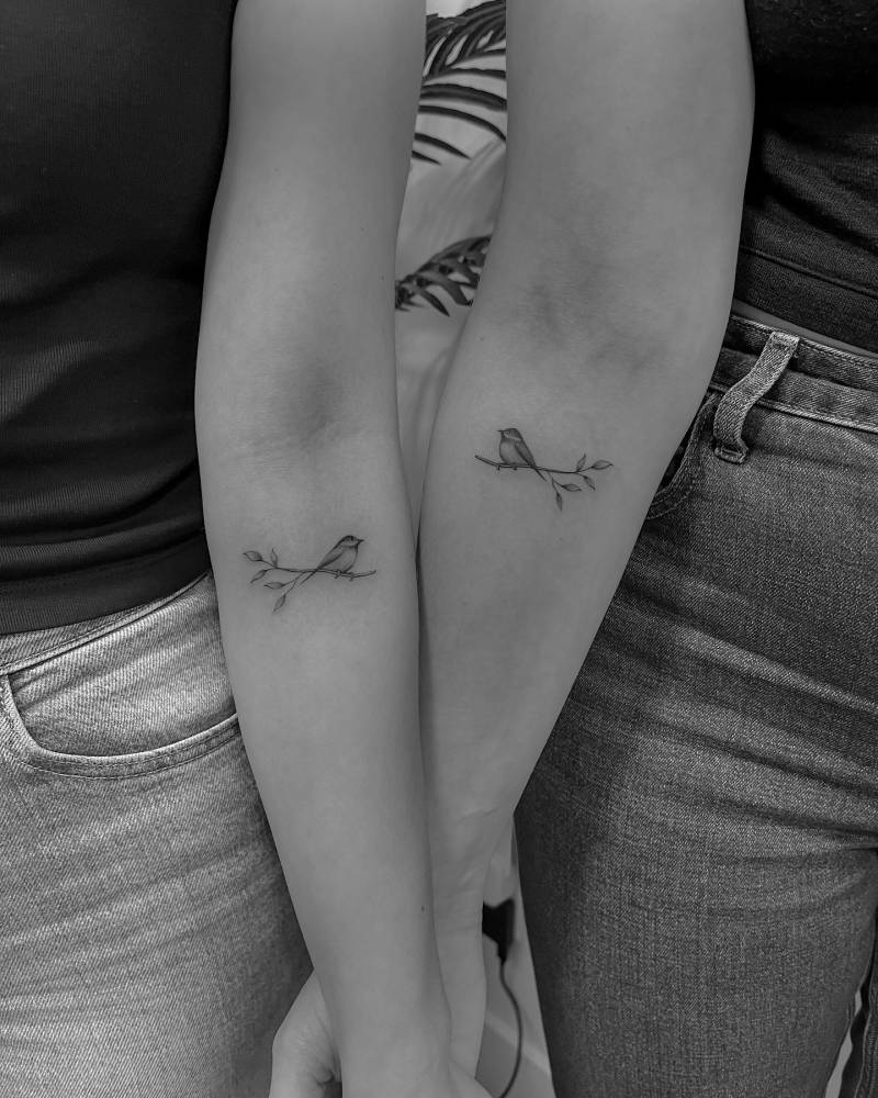 Matching bird on a branch tattoo for best friends.
