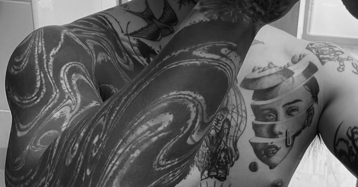 Healed abstract sleeve tattoo in blackwork style.