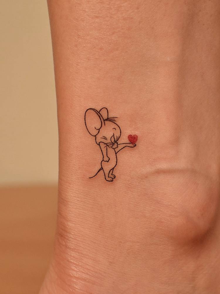 Jerry tattoo in fine line style located on the ankle.