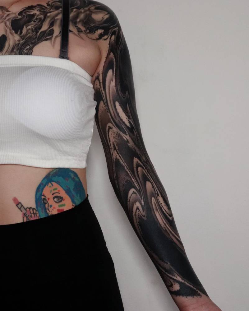 Blackwork style abstract tattoo sleeve.