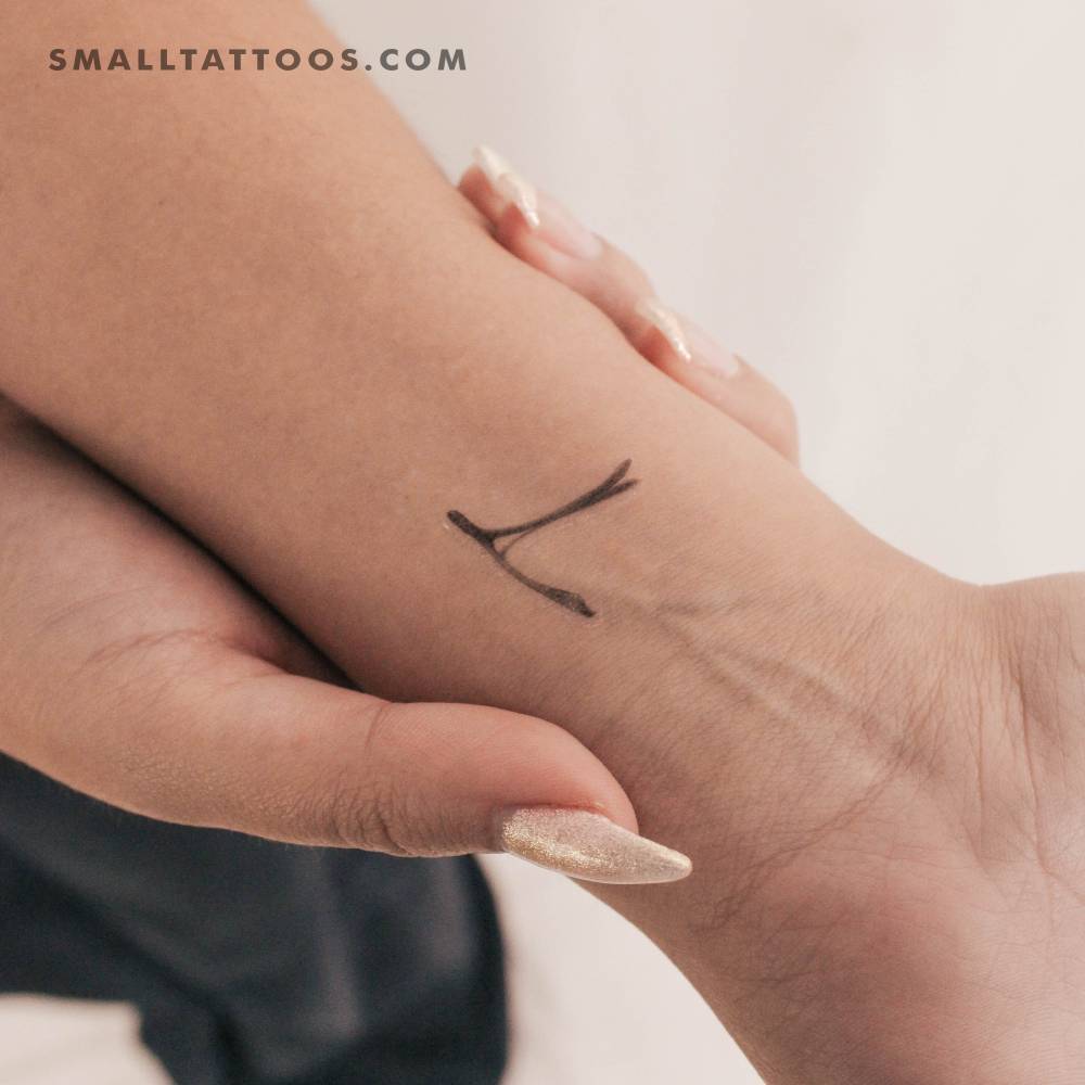 Realistic wishbone temporary tattoo located on the wrist.