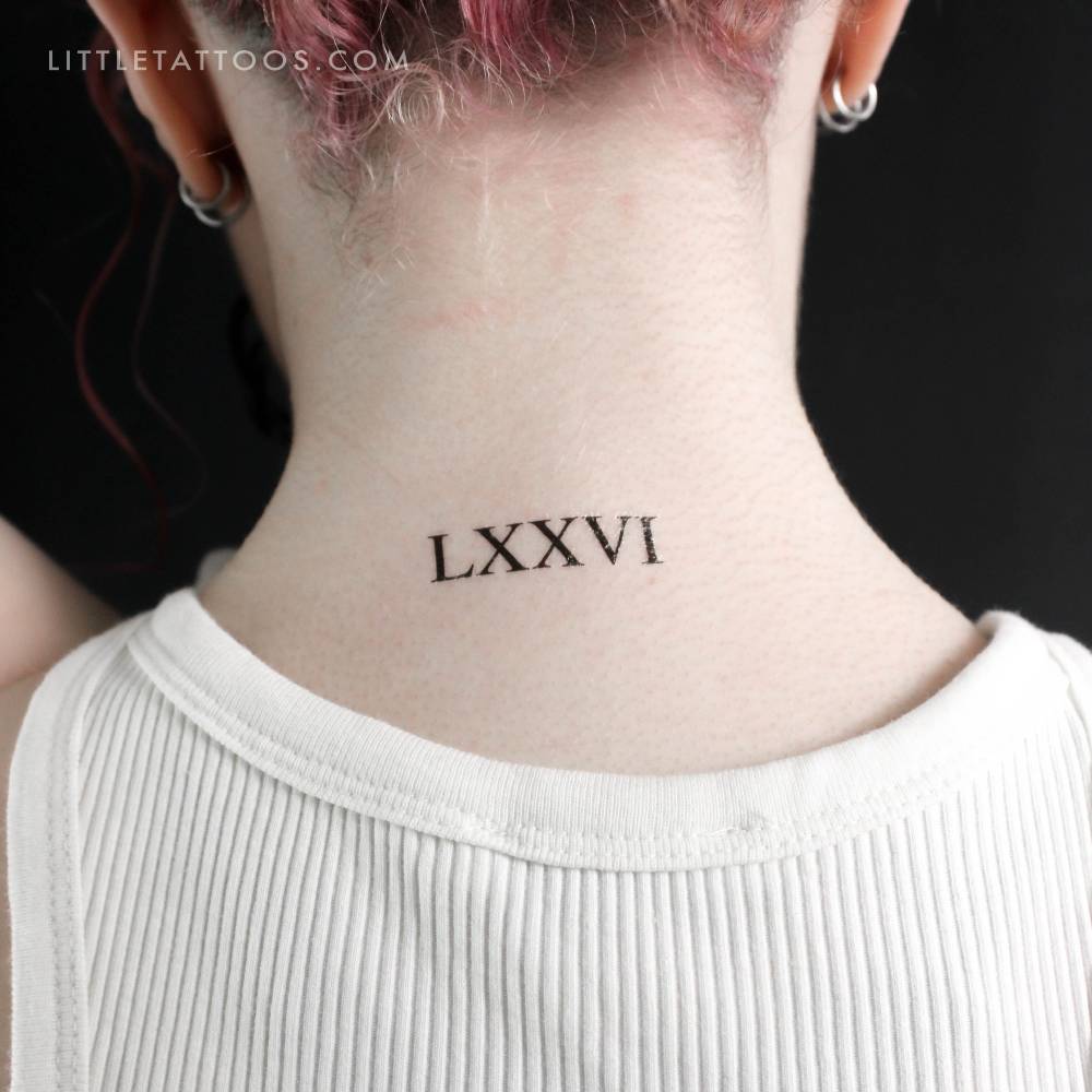 "LXXVI" temporary tattoo located on the back of the neck.
