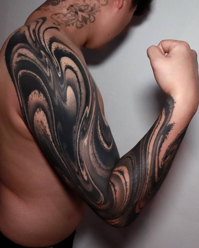Blackwork style abstract tattoo sleeve.
