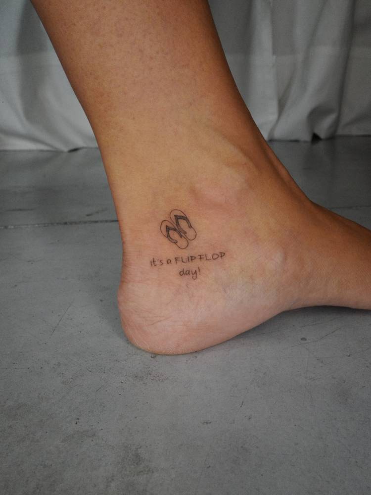Minimalistic style flip flops tattoo located on the ankle.