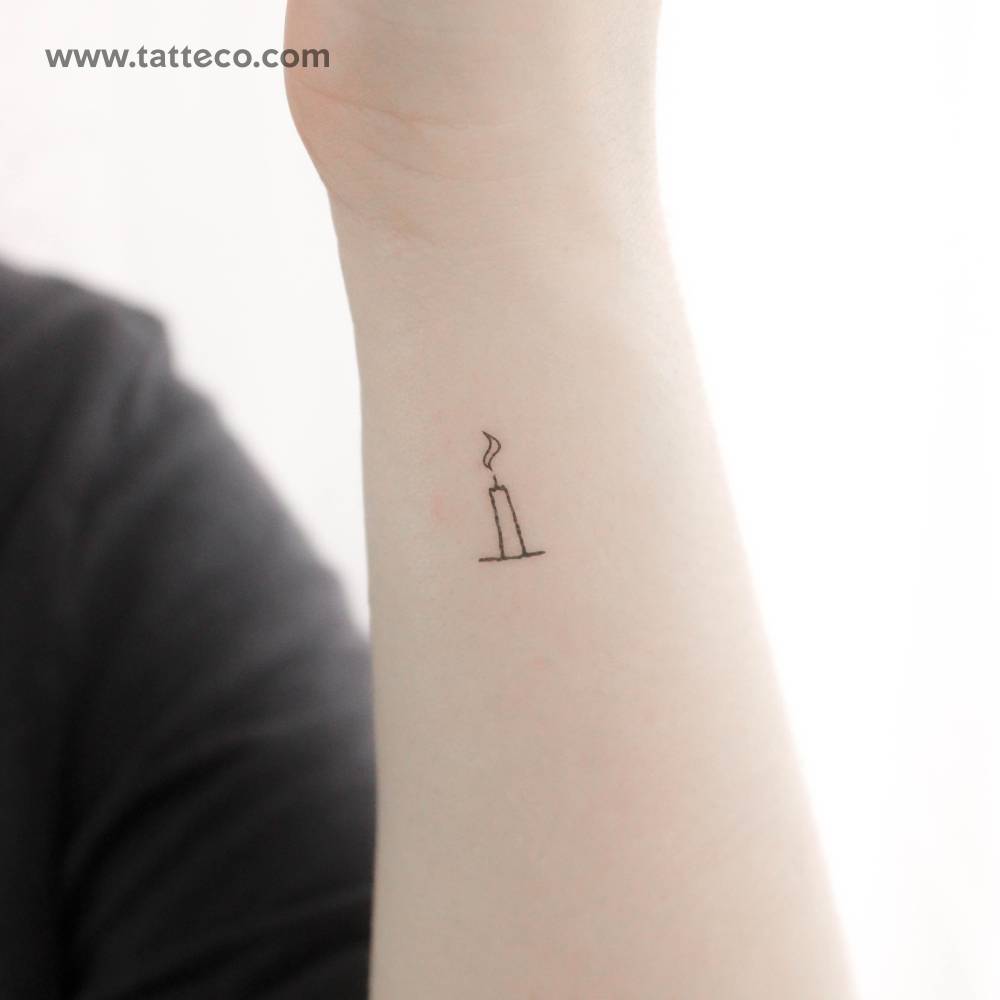 Minimalistic style candle temporary tattoo located on the wrist.