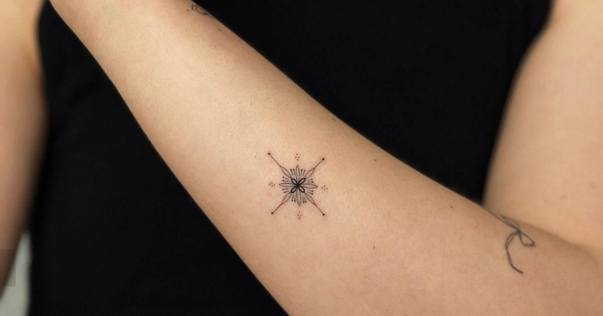 Ornamental tattoo in fine line style located on the
