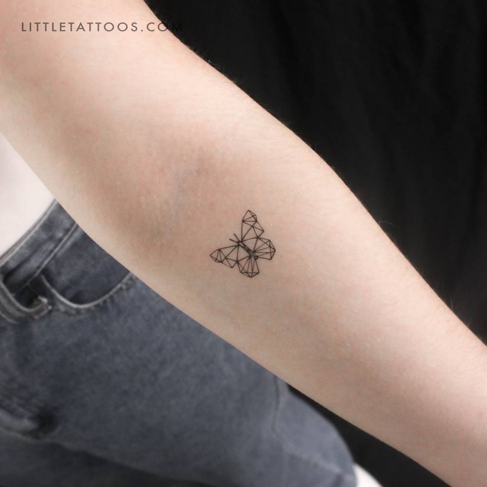 Low poly butterfly temporary tattoo located on the inner forearm.