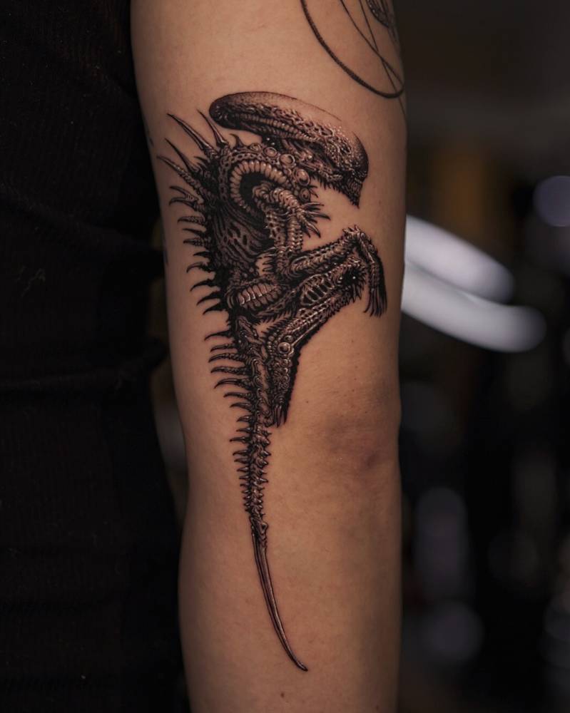 Comic style Xenomorph tattoo located on the arm.