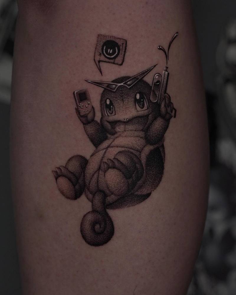 Squirtle tattoo located on the calf, done in cartoon style.