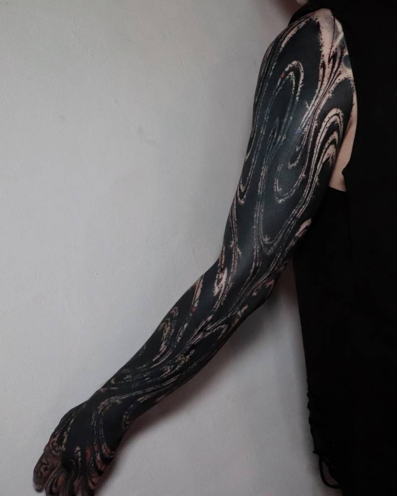 Blackwork style abstract cover-up tattoo sleeve.