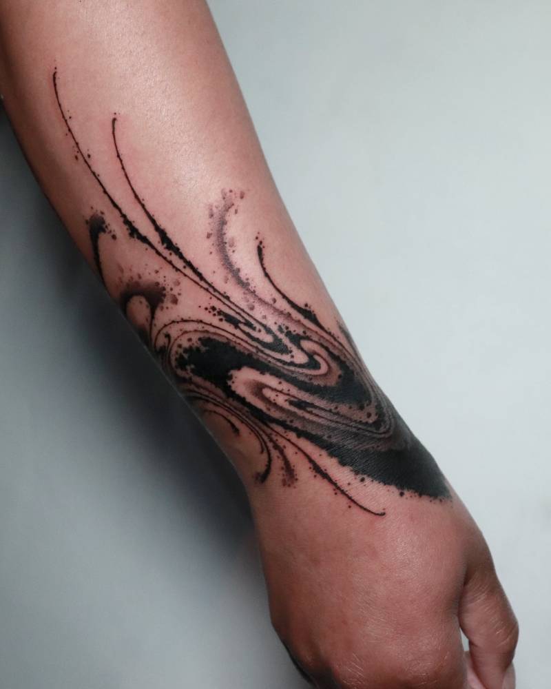 Bracelet flow tattooed on the wrist, blackwork style.