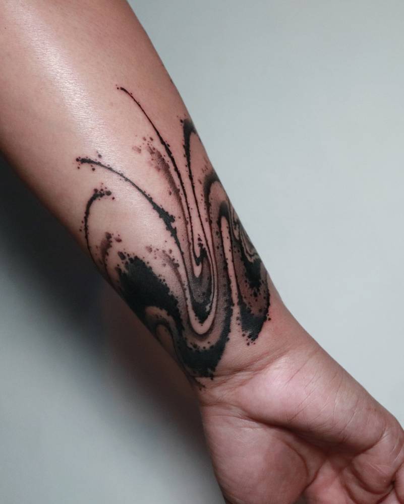 Bracelet flow tattooed on the wrist, blackwork style.