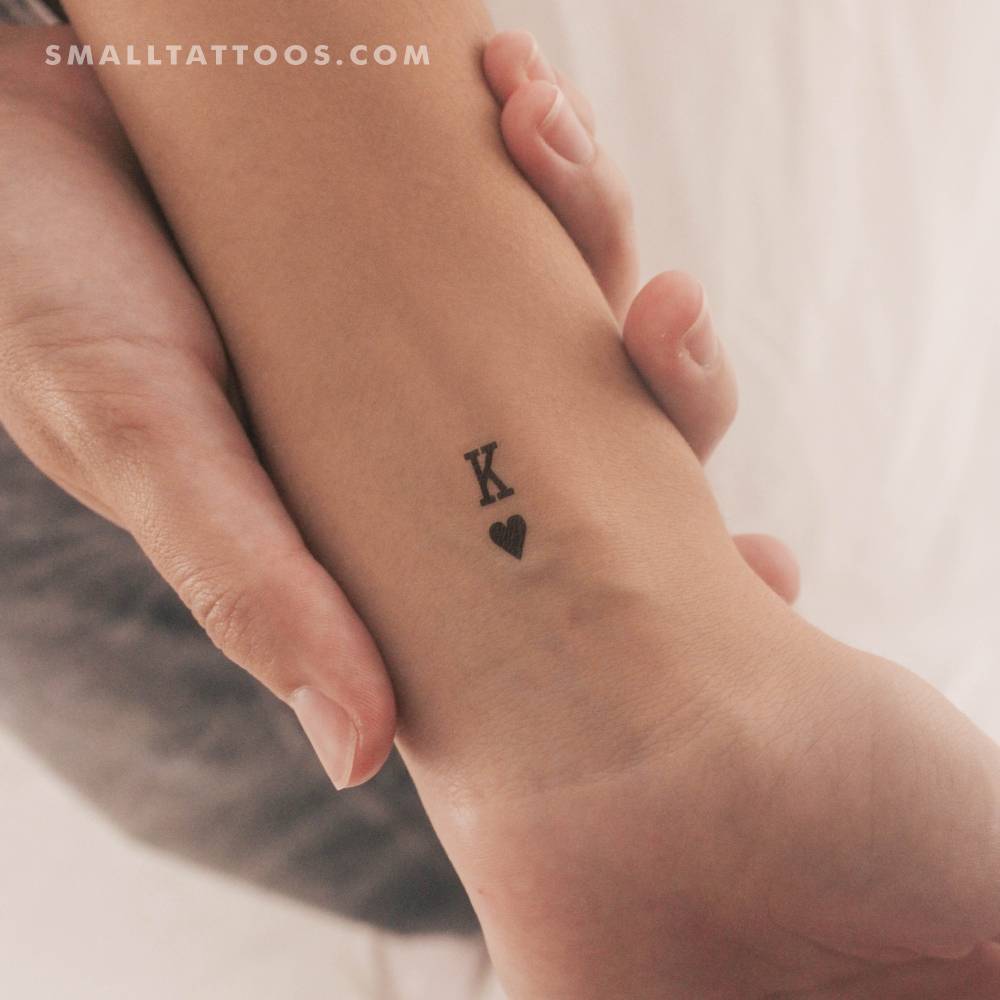 Black King Of Hearts temporary tattoo located on the wrist.