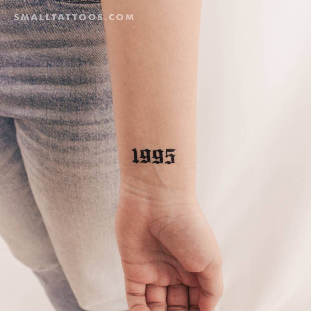 Gothic font "1995" birth year temporary tattoo located on the wrist.