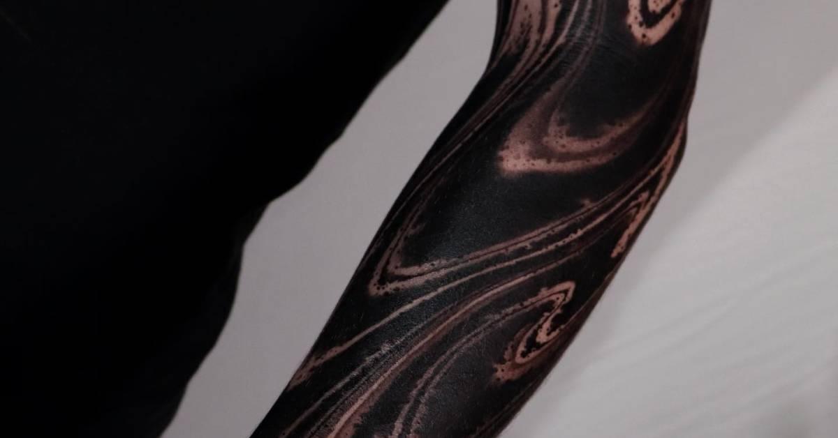 Blackwork style abstract tattoo sleeve.