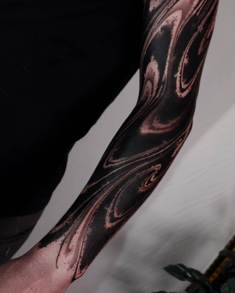 Blackwork style abstract tattoo sleeve.