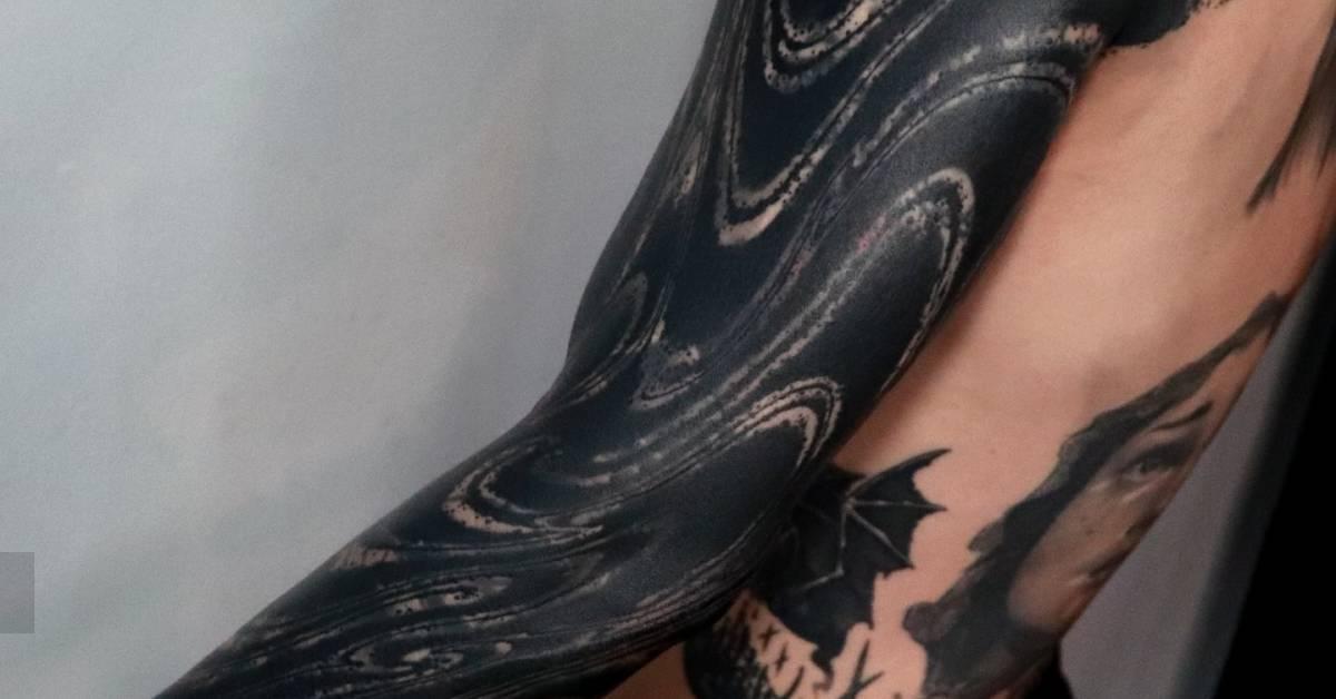 Blackwork style abstract sleeve cover up tattoo.
