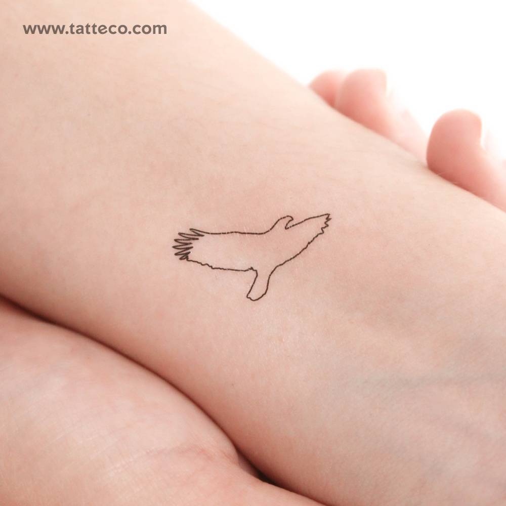Fine line style eagle outline temporary tattoo located on the wrist.