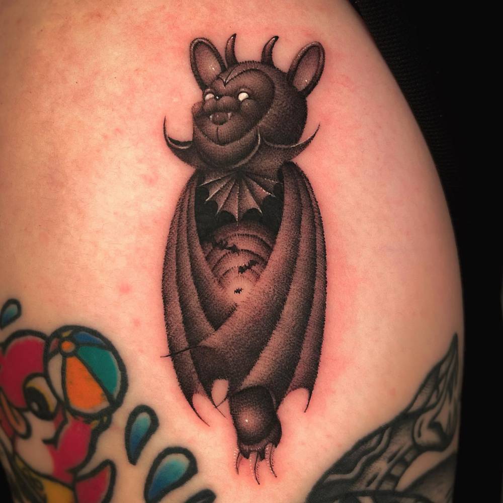 Bear bat tattoo located on the the shoulder, dotwork style.