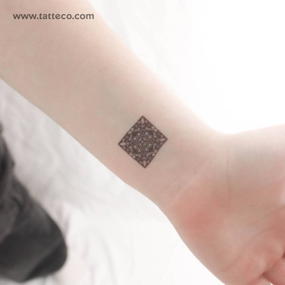 Little Portuguese tile temporary tattoo placed on the wrist.