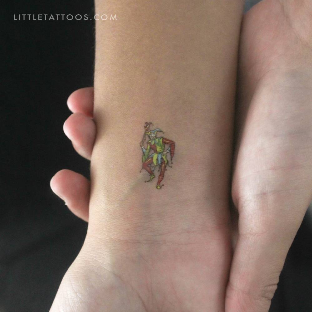 Illustrative style joker temporary tattoo located on the wrist.