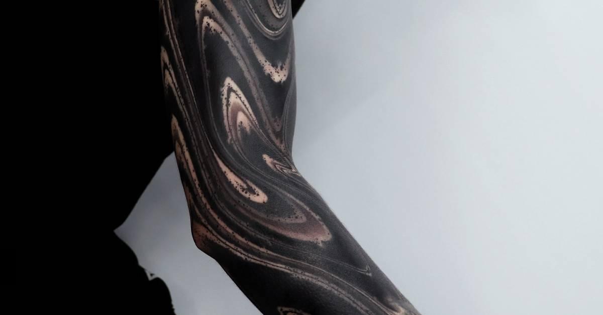 Blackwork style abstract tattoo sleeve.