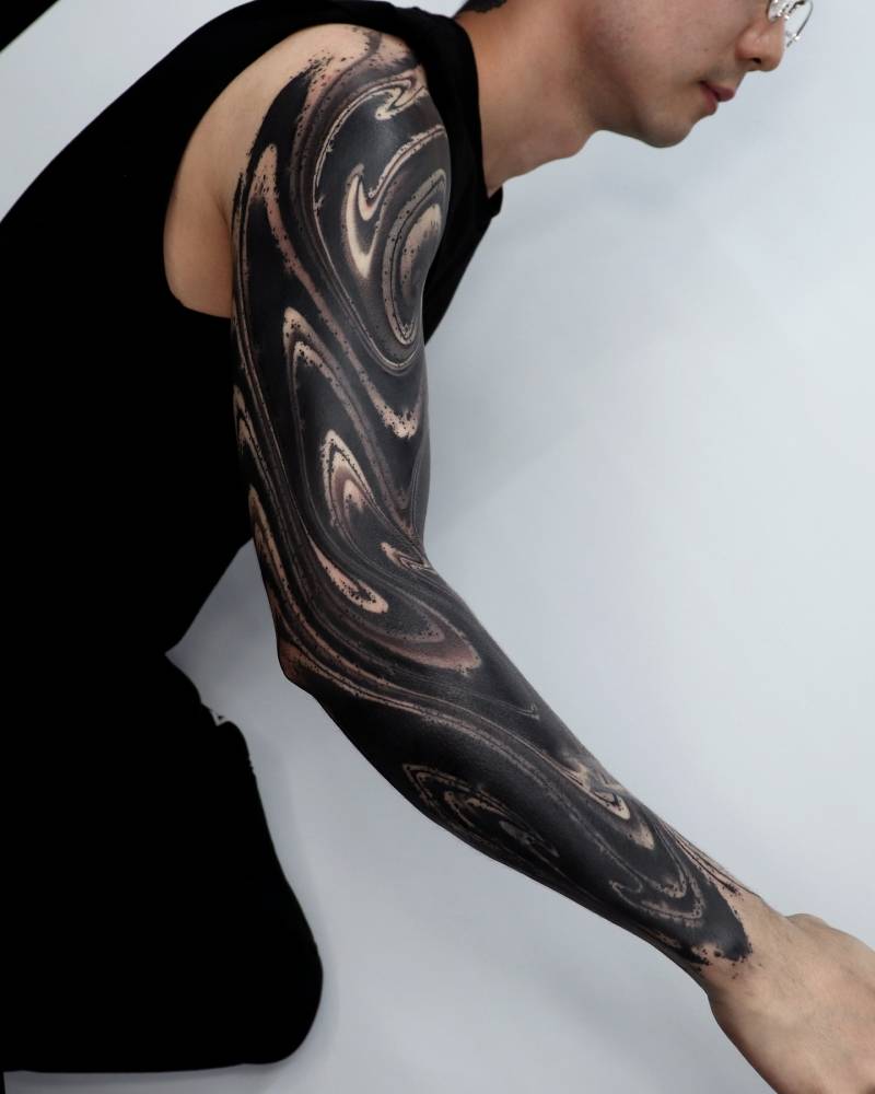 Blackwork style abstract tattoo sleeve.