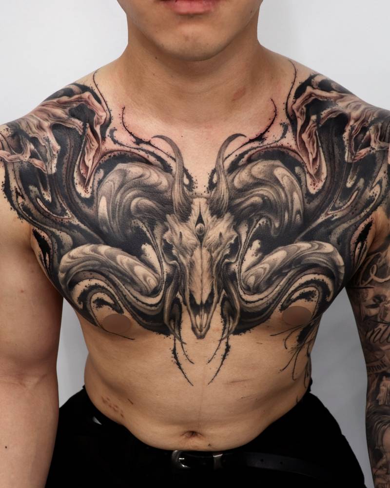 Baphomet tattoo in abstract style located on the chest.