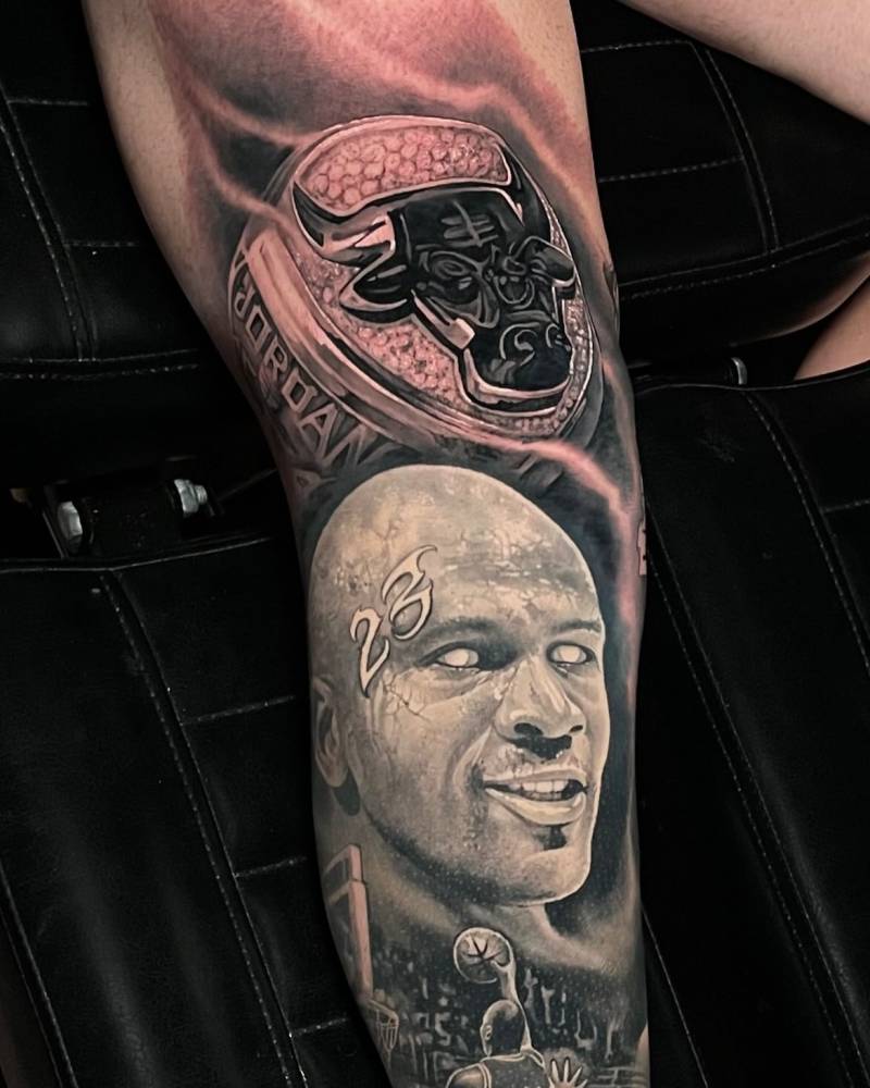Healed Jordan portrait and fresh Chicago Bulls ring tattooed on the leg.