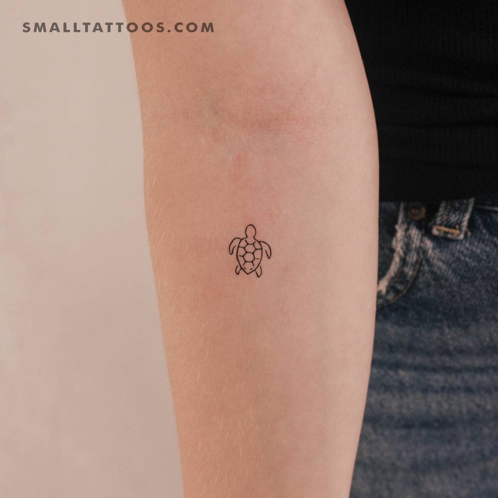 Little minimalistic turtle temporary tattoo placed on the inner forearm.