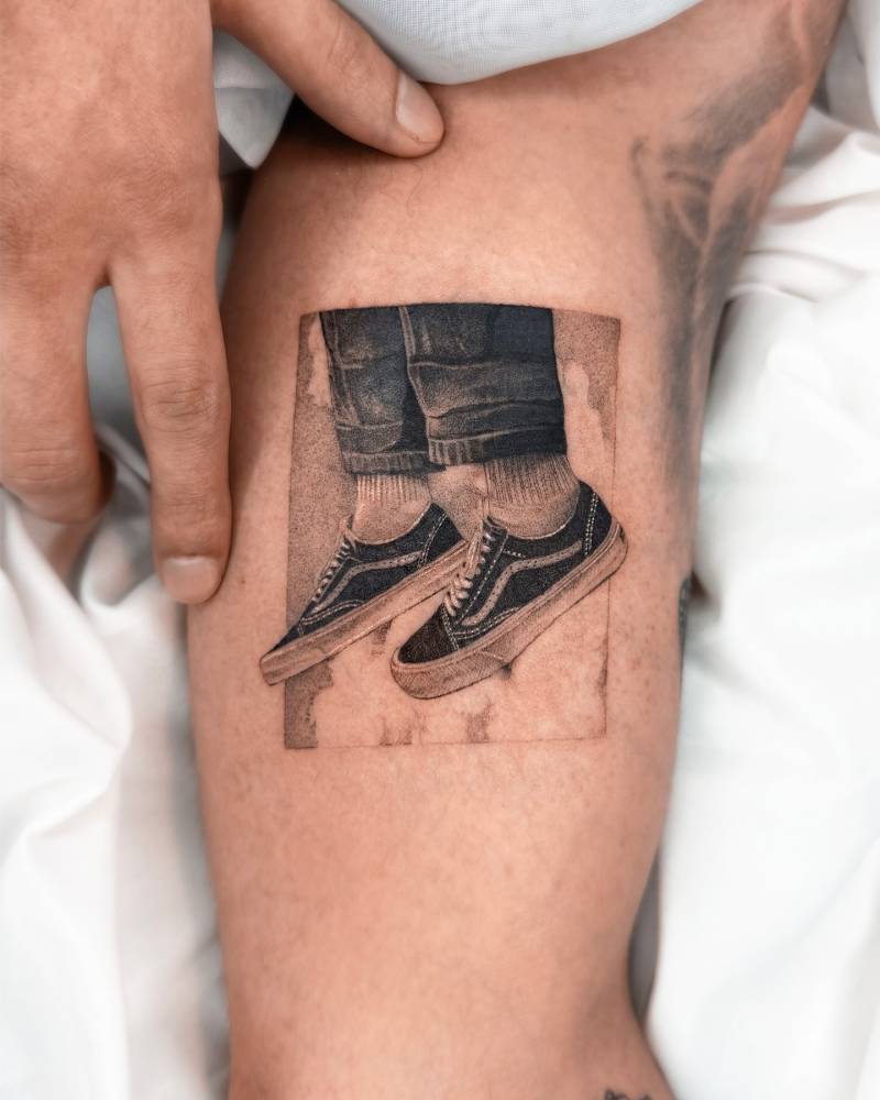 Vans Old Skool tattoo located on the inner arm, done in micro-realistic style.