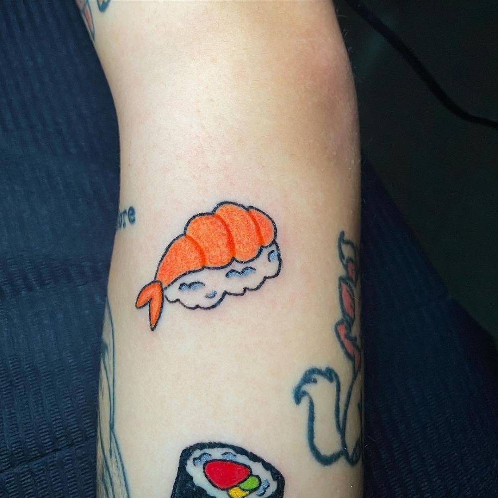 Shrimp nigiri tattoo located on the forearm.