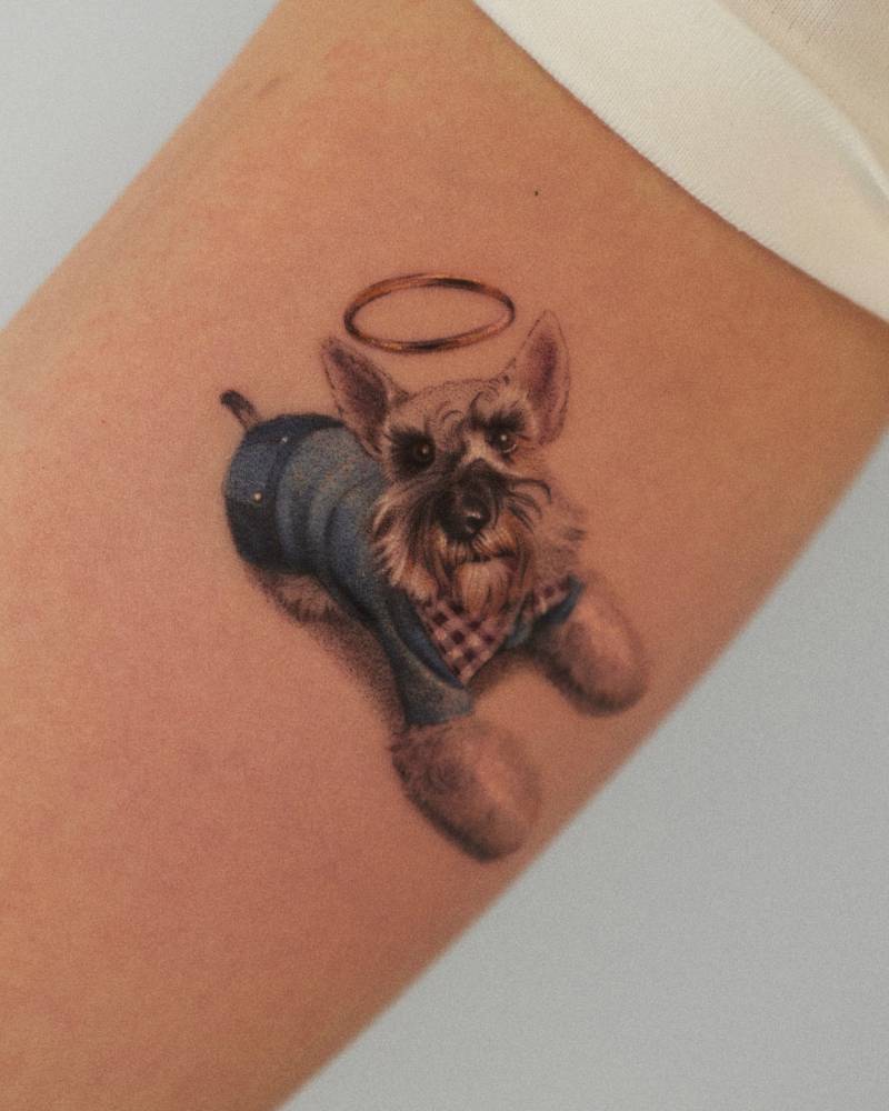 Memorial Schnauzer tattoo in micro-realistic style located on the inner arm.