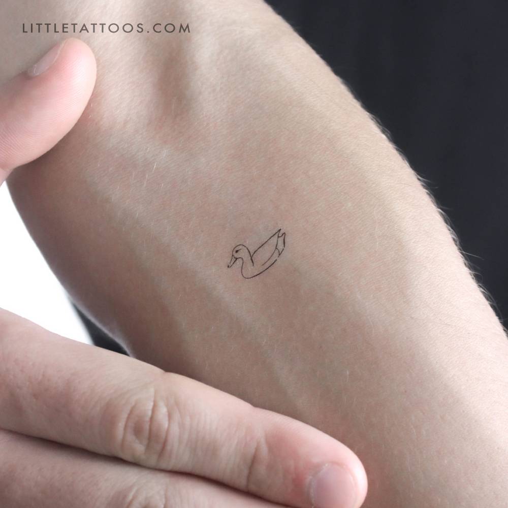 Fine line style duck temporary tattoo located on the inner forearm.
