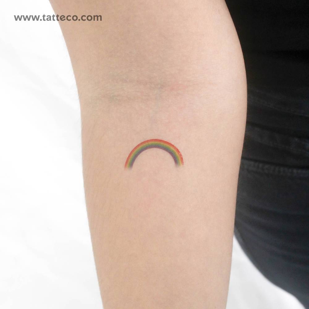 Color rainbow temporary tattoo located on the inner forearm.