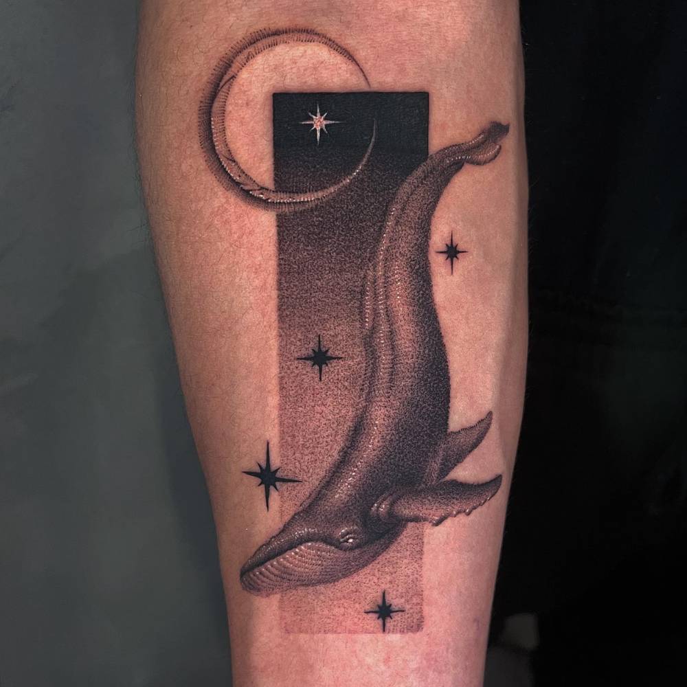 Dotwork style whale tattoo located on the inner forearm.