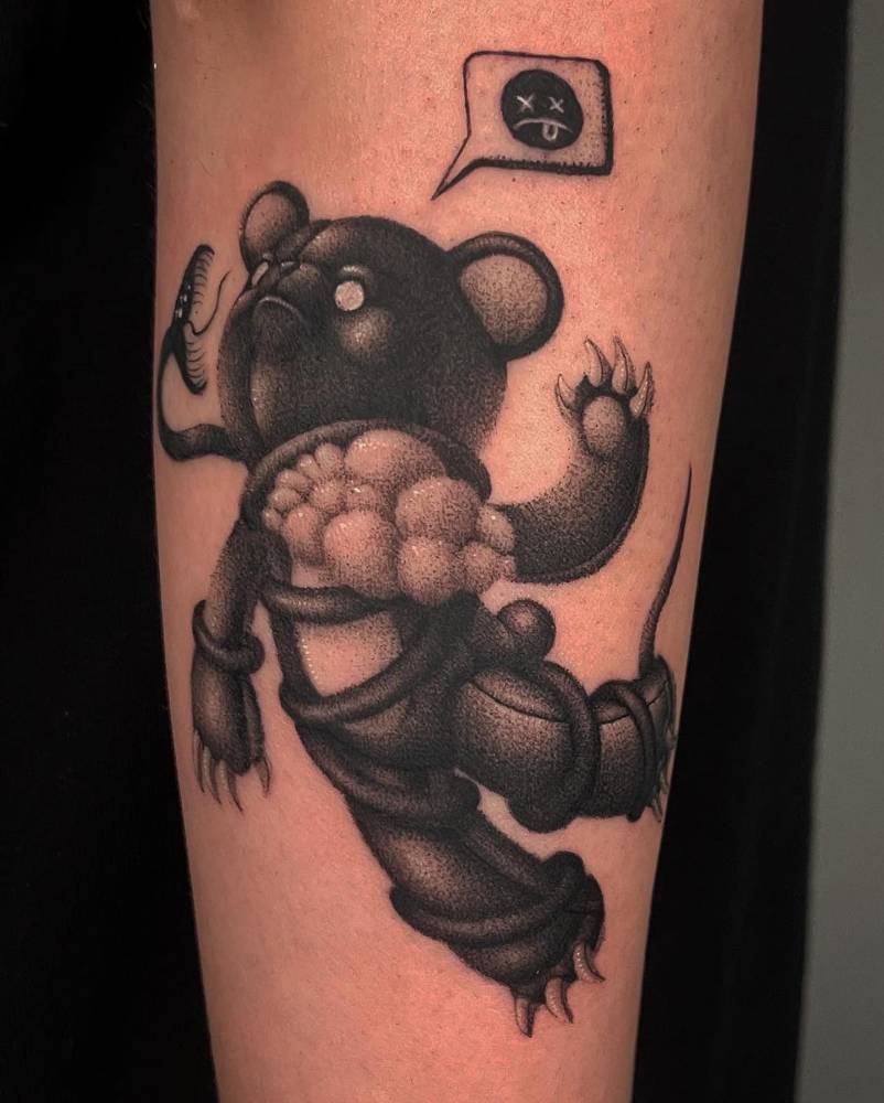Dotwork style teddy bear tattoo located on the forearm.