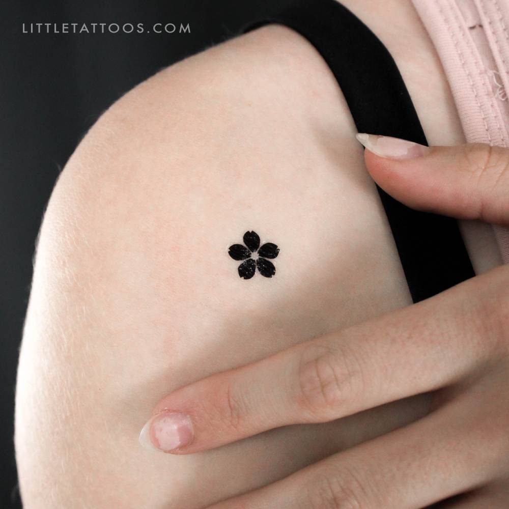 Blackwork style sakura temporary tattoo located on the shoulder.