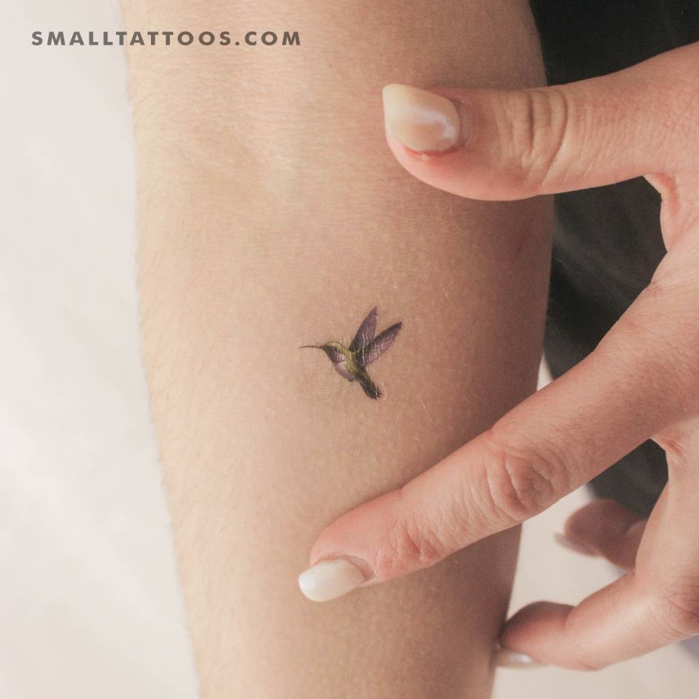 Watercolor style hummingbird temporary tattoo located on the inner forearm.