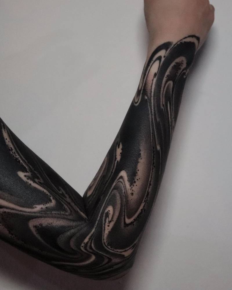 Blackwork style abstract tattoo sleeve.