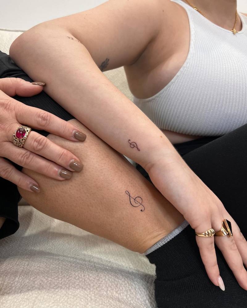 Matching minimalistic treble clef tattoo for best friends.