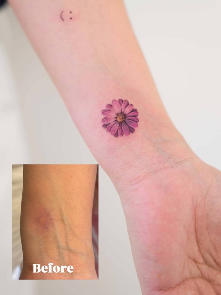 Gerbera flower touch up tattoo in micro-realistic style.
