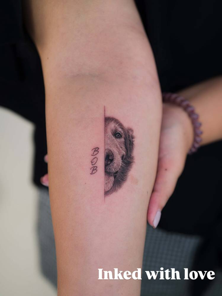 Golden Retriever portrait tattoo located on the inner forearm.