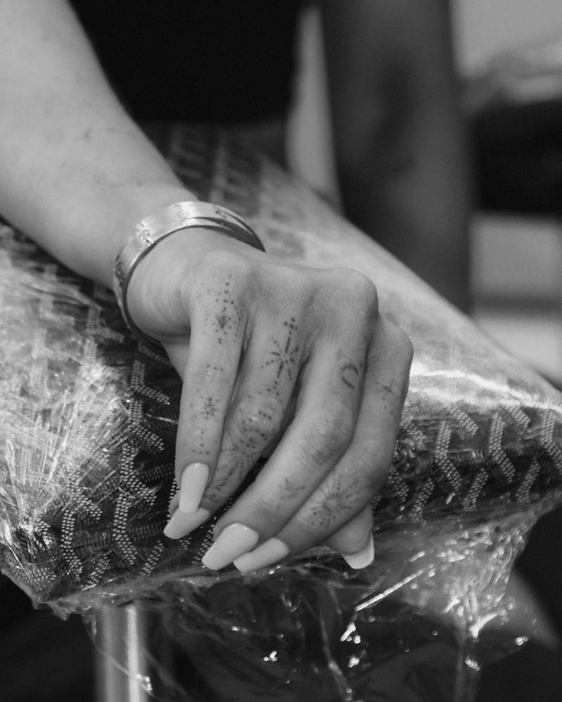 Olivia Attwood's finger composition tattoos.