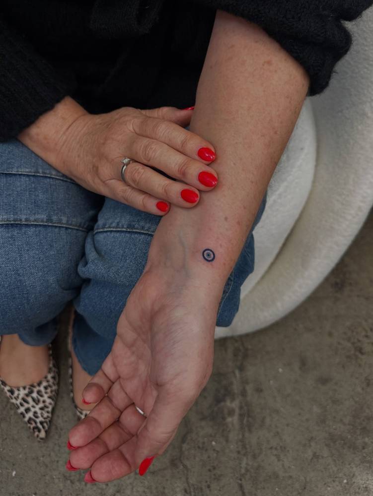 Tiny minimalistic Nazar tattoo done on the wrist.