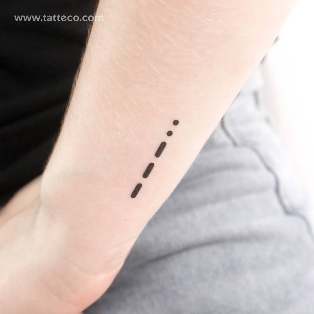 Minimalistic style Morse Code 8 temporary tattoo located on the wrist.