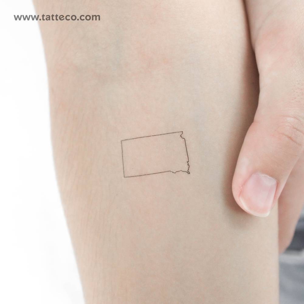 South Dakota map outline temporary tattoo located on the inner forearm.